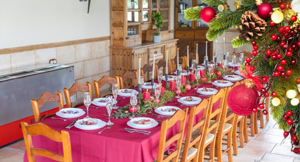 a long table with red table cloth and christmas decorations at Summer Dream by Fidalsa in Catral