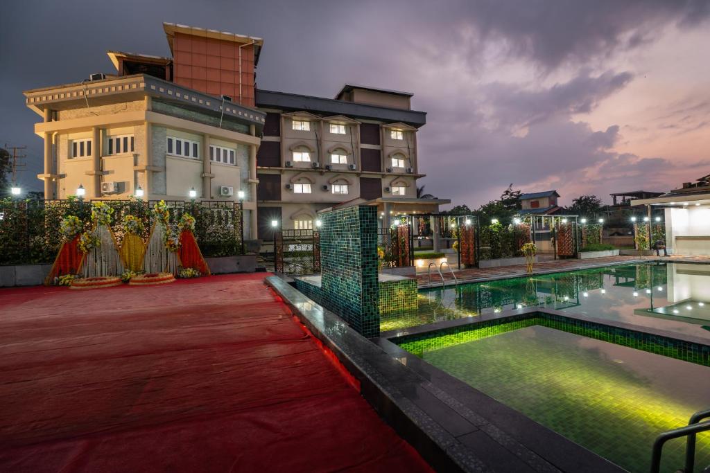 a hotel with a swimming pool in front of a building at Himalayan Gateway By Dept Of Tourism, GTA in Jāmb