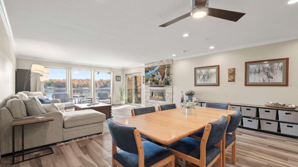 a living room with a table and a couch at Lakeside Haven - Condo for 8 in Sunrise Beach