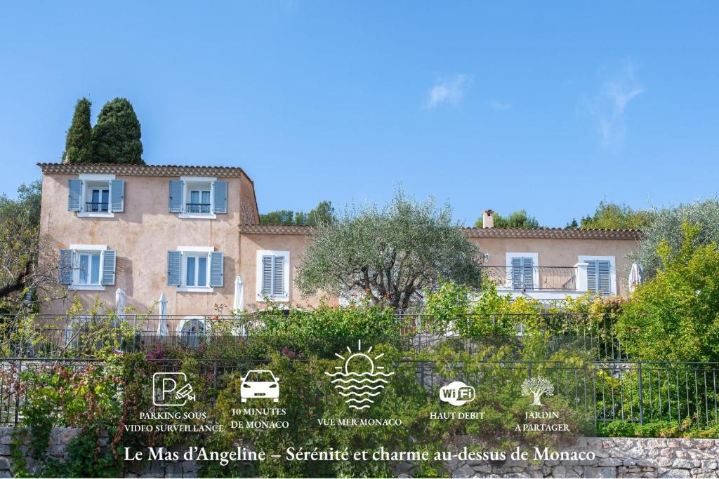 a building with a sign in front of it at Le Mas d'Angeline-Vue mer panoramique, jardin partagé, parking, voiture indispensable, route étroite et pentue, à 10 min de Monaco in Beausoleil