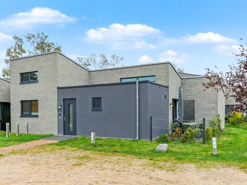 a brick house with a garage at Holiday Home Sonnenpfad by Interhome in Lembruch