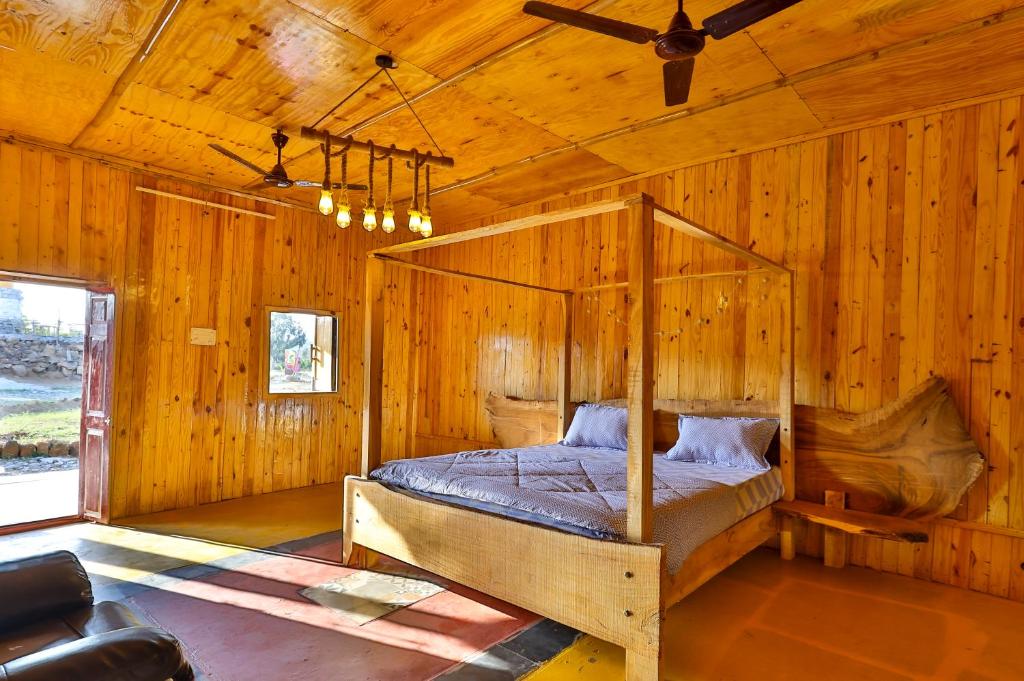 Ένα ή περισσότερα κρεβάτια σε δωμάτιο στο The Buddha Village