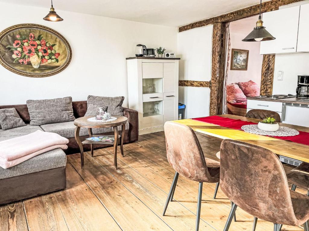 a living room with a table and a couch at Apartment Therese by Interhome in Mirow