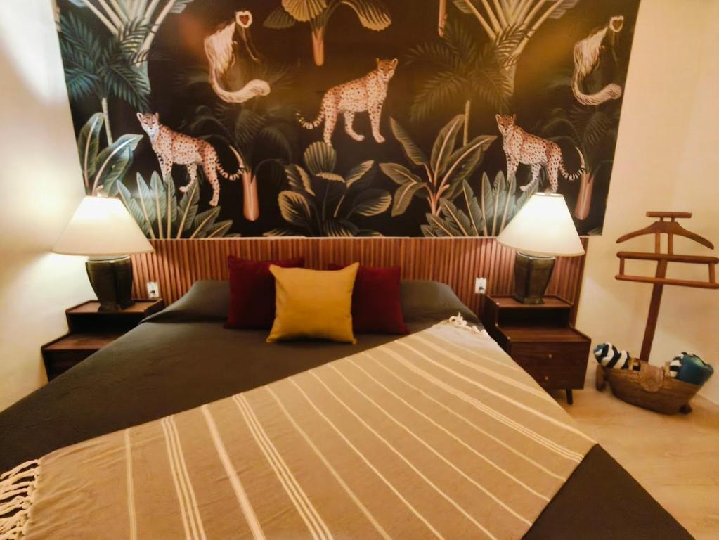 Ένα ή περισσότερα κρεβάτια σε δωμάτιο στο Casa Rocka Boutique Isla Mujeres