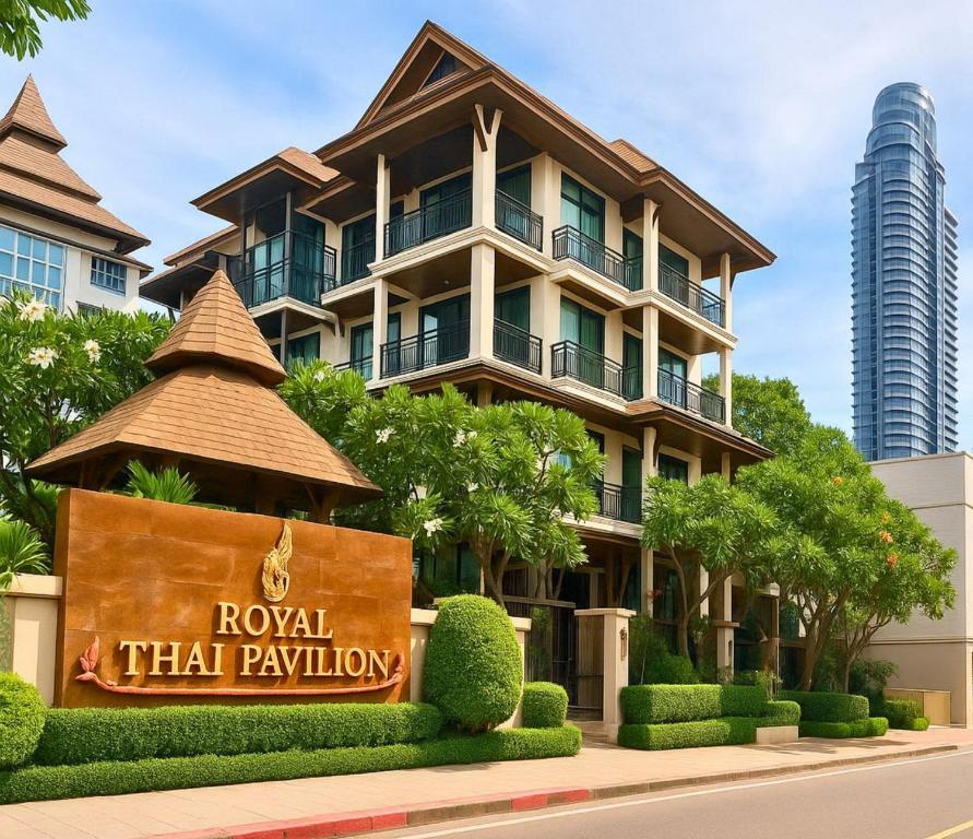 a building with a sign in front of it at Royal Heritage Pavilion, Jomtien in Jomtien Beach