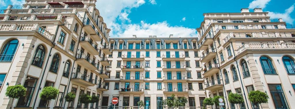 a large building in front of a building at "Авторский" Riviera View Apartment in Fontanka