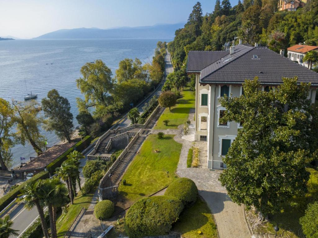 an aerial view of a house next to the water at Apartment Villa Ceriana-5 by Interhome in Ghiffa