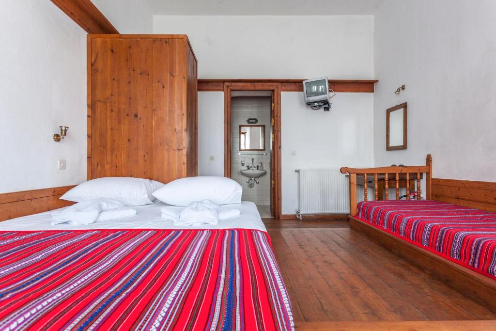 Postel nebo postele na pokoji v ubytování Archontiko Filippidi