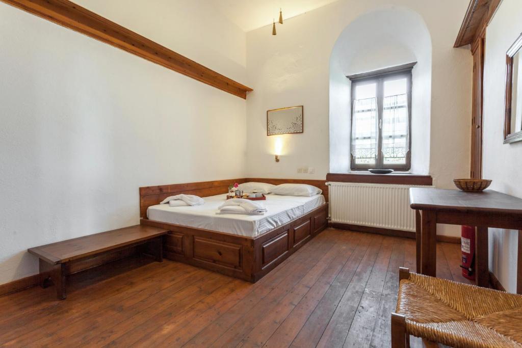 Postel nebo postele na pokoji v ubytování Archontiko Filippidi
