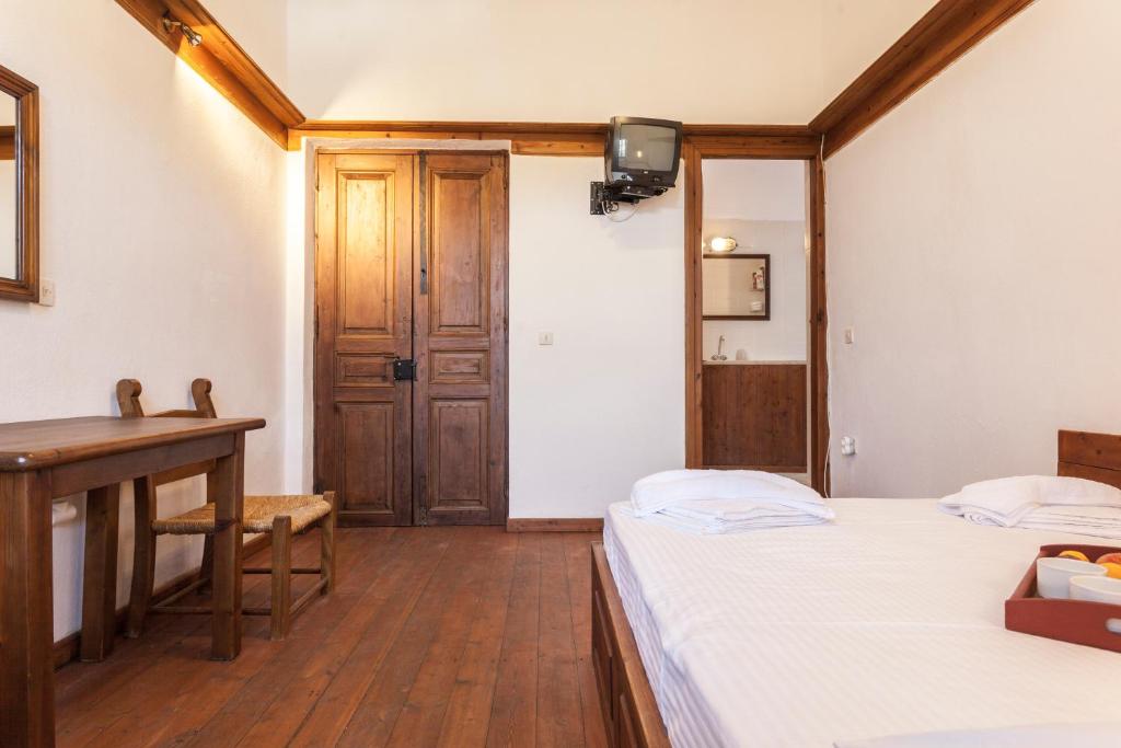 Postel nebo postele na pokoji v ubytování Archontiko Filippidi