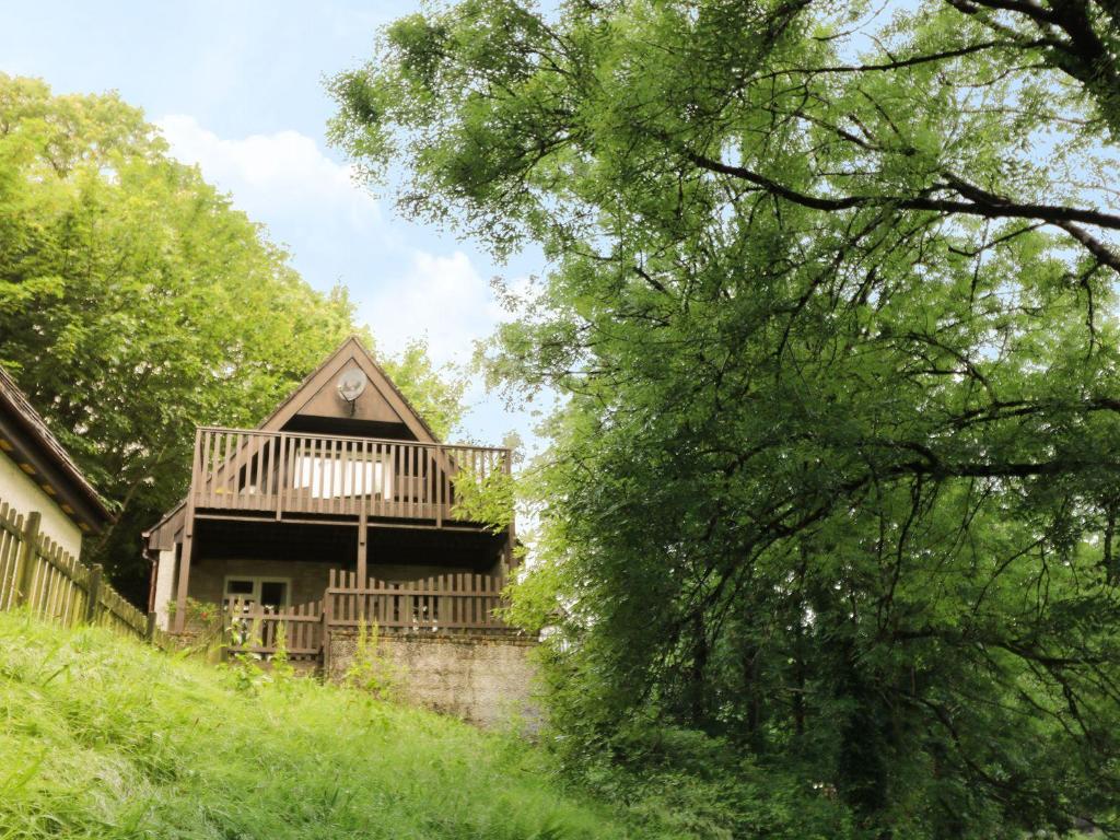 a house with a deck on the side of it at Valley Lodge 61 in Callington