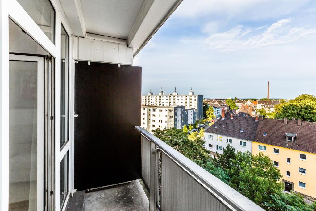 an apartment balcony with a view of a city at Fair Apartments Cologne in Cologne