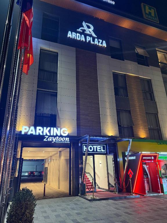 a parking sign on the front of a building at Arda Plaza Hotel in Tashkent