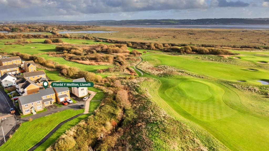 an aerial view of the golf course at cape kidnappers resort at Finest Retreats - Ffordd Y Meillion in Llanelli