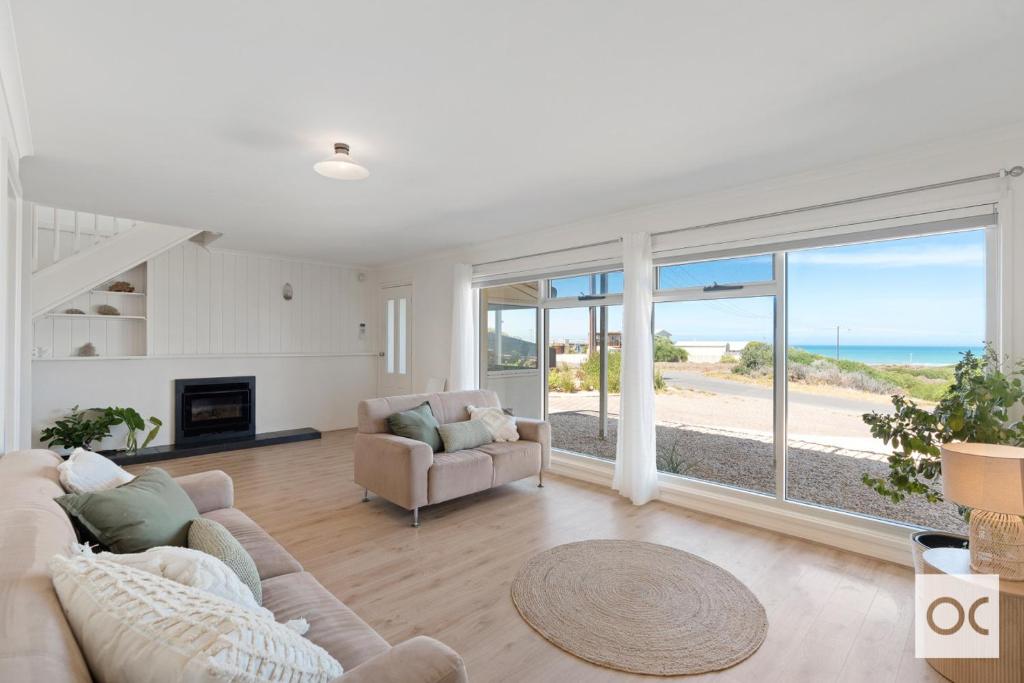 a living room with a view of the ocean at Amazing Views in Middleton