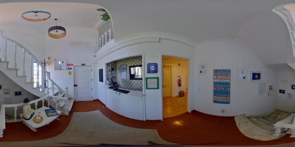 a hallway of a building with stairs and a room at Casa das Hortênsias - Charming Guest House in Sintra
