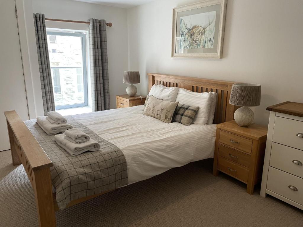 En eller flere senge i et værelse på Raven Wing 11 - Kintail Apartment