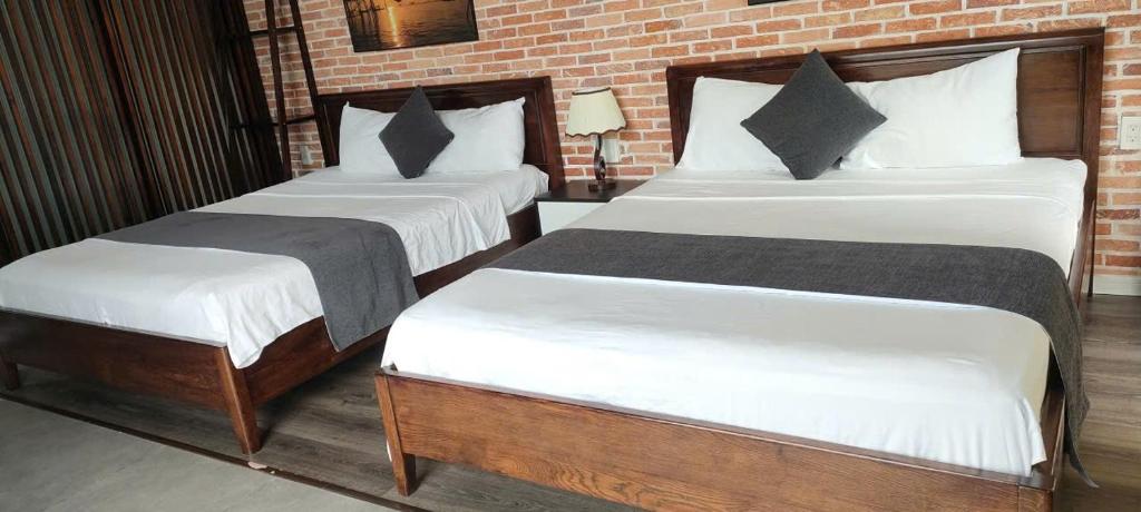 Ένα ή περισσότερα κρεβάτια σε δωμάτιο στο Anchie Retreat Villa Hội An