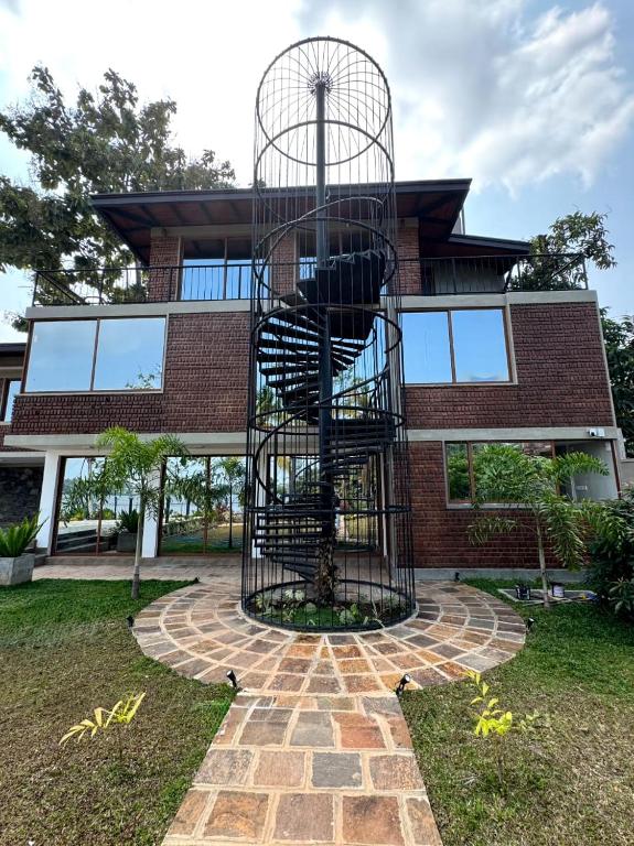 a metal spiral staircase in front of a building at The Windsor Retreat in Moratuwa