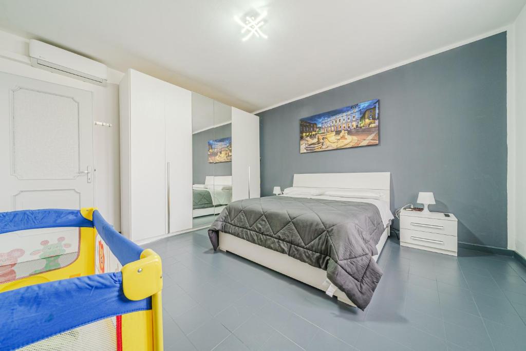 a bedroom with a bed and a blue wall at Casa Francesco - close to the airport & private parking in Azzano San Paolo