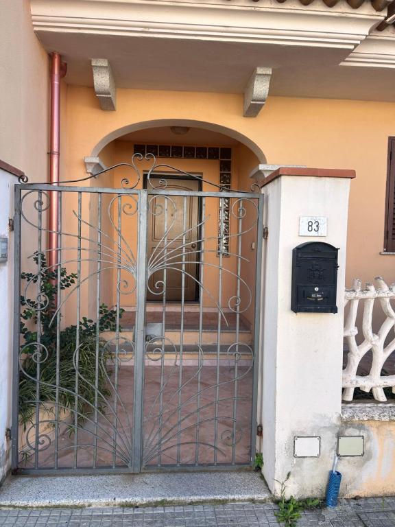 an entrance to a house with an iron gate at Le Mille e Una Notte II in Olbia