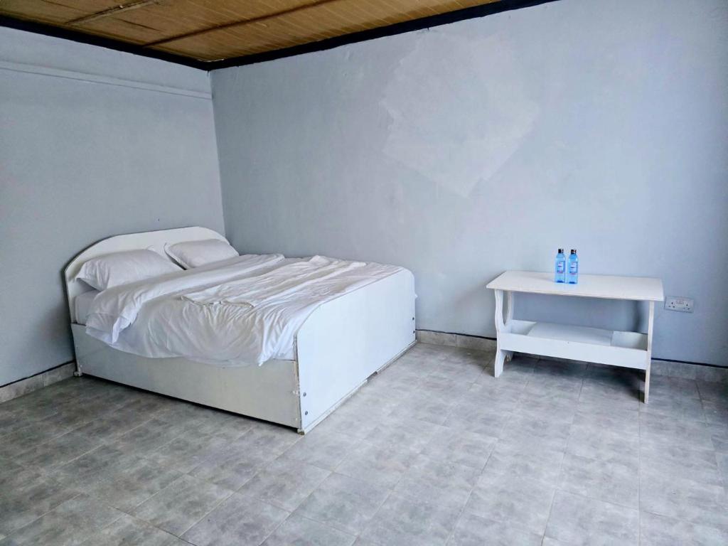 Postel nebo postele na pokoji v ubytování Tunda Paradise Motel & Gardens