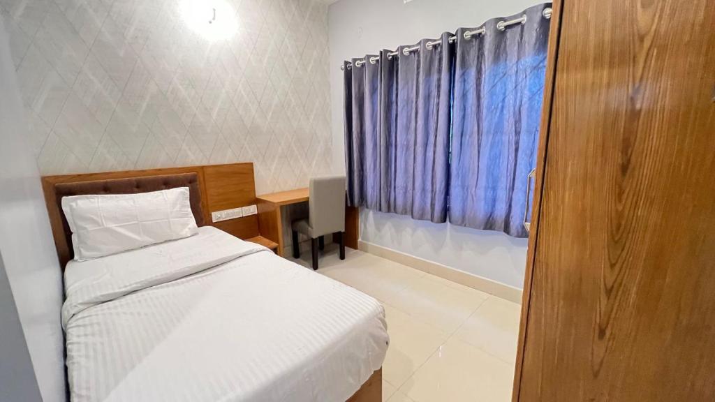 Ένα ή περισσότερα κρεβάτια σε δωμάτιο στο Hotel Riviera