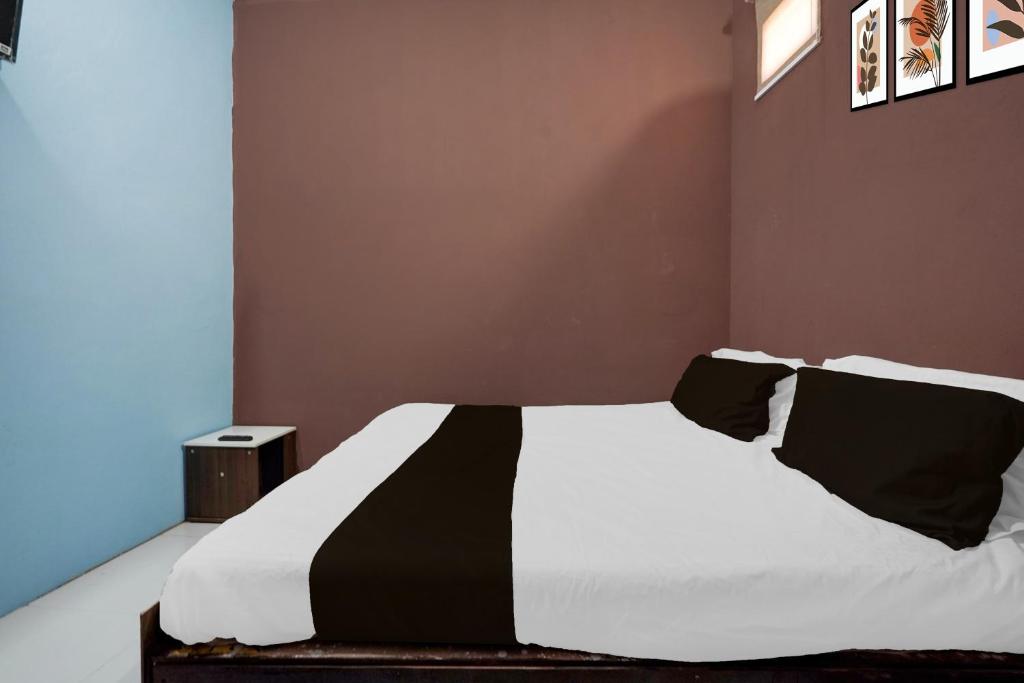 Ένα ή περισσότερα κρεβάτια σε δωμάτιο στο Hotel O Mahlawat