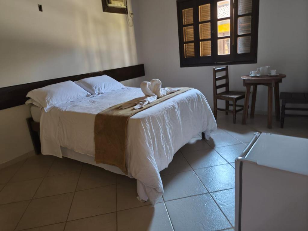 Postel nebo postele na pokoji v ubytování Pousada Manga Rosa