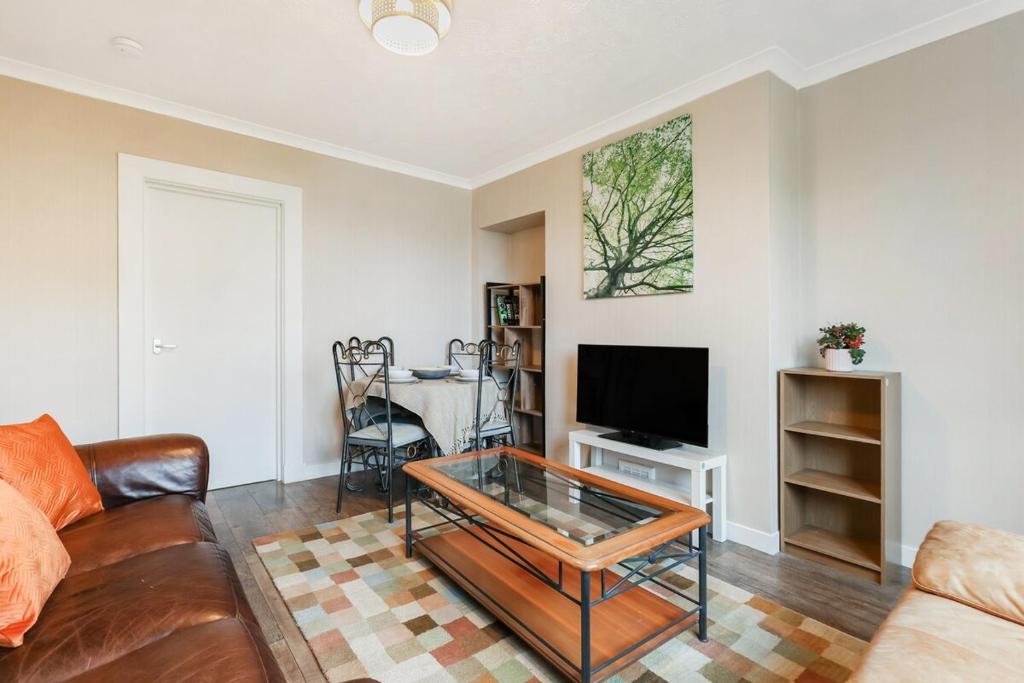 a living room with a couch and a table at Free Parking - Central - Sleeps 6 - Great Location in Armadale