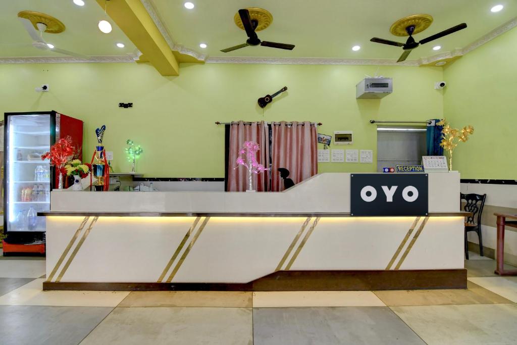 a cashier counter in a store with a wow sign on it at Hotel O AM2PM Restaurant Bar 