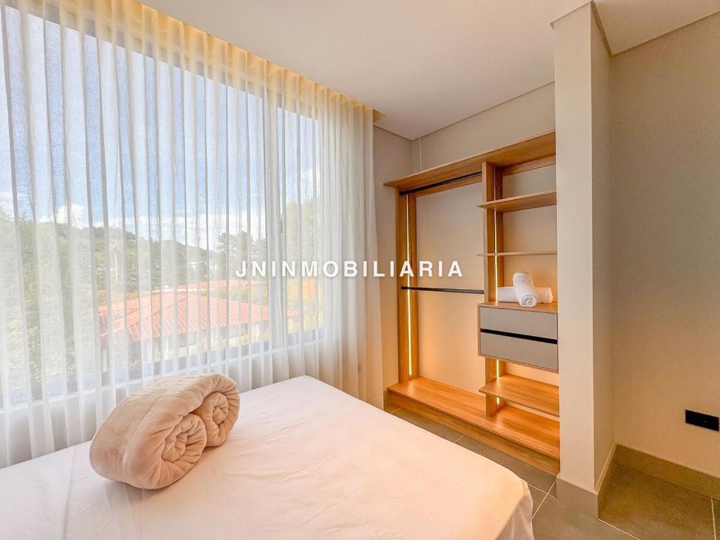 Кровать или кровати в номере Apartamento de lujo a 3 minutos del Aeropuerto JMC 302