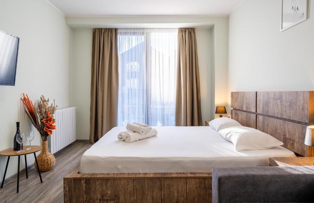 Giường trong phòng chung tại New Gudauri, Loft 1 Apartment