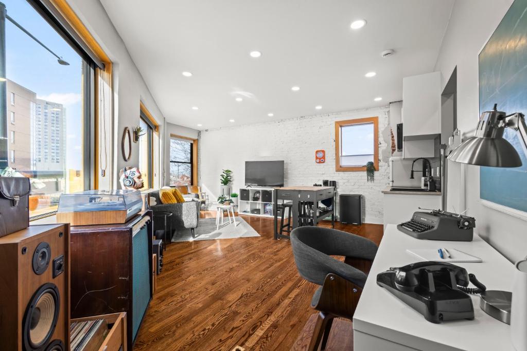 a room with a kitchen and a living room at Downtown Denver Suite - Skyline Views in Denver