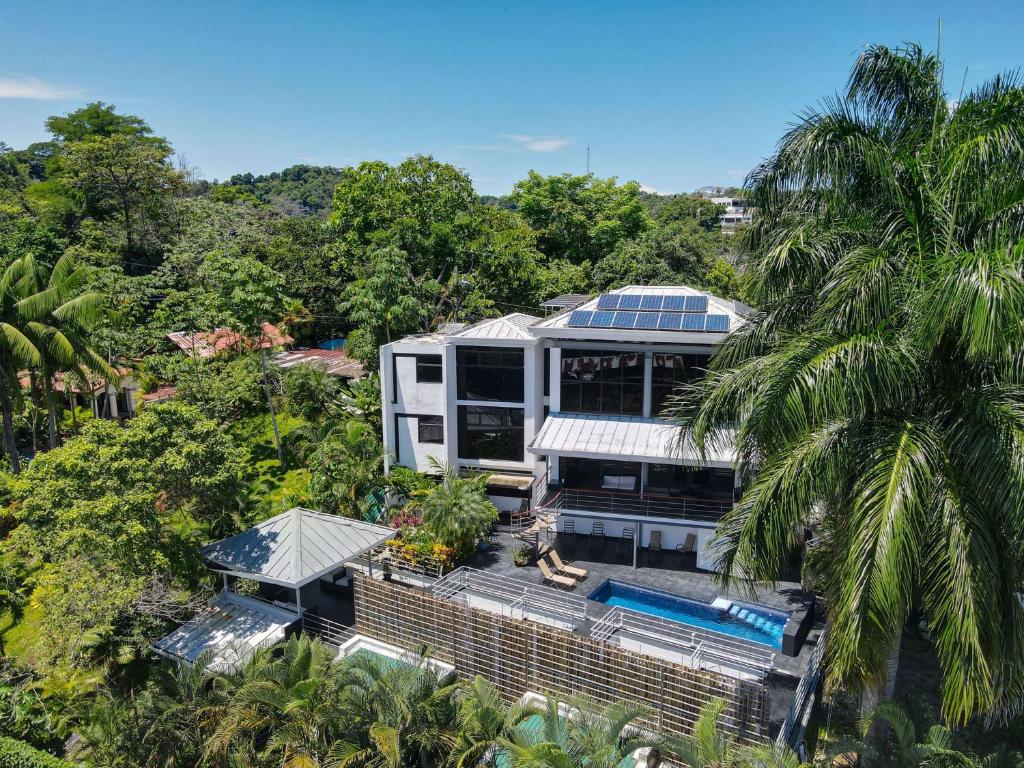 an aerial view of a house with a swimming pool at Casa Cielo Luxury Jungle Retreat, Manuel Antonio in Quepos