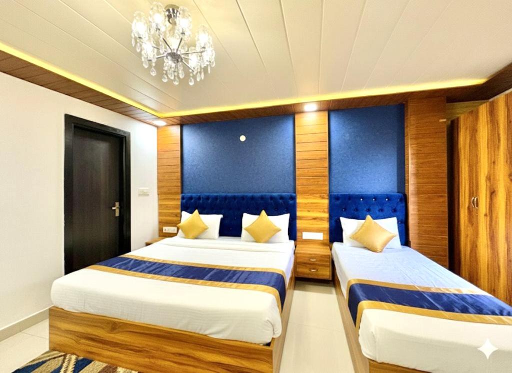 En eller flere senge i et værelse på BellMount Hotel Near Delhi Airport