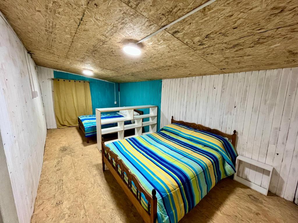 Ένα ή περισσότερα κρεβάτια σε δωμάτιο στο Hospedaje Rural