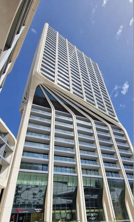 a tall building with a lot of windows at Mercury tower Elena K 24th Floor panoramic view Apt in St. Julianʼs