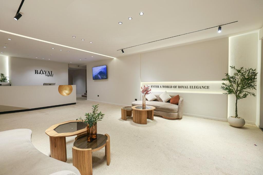 a living room with a couch and a table at Royal Regency Eg Hotel in Cairo