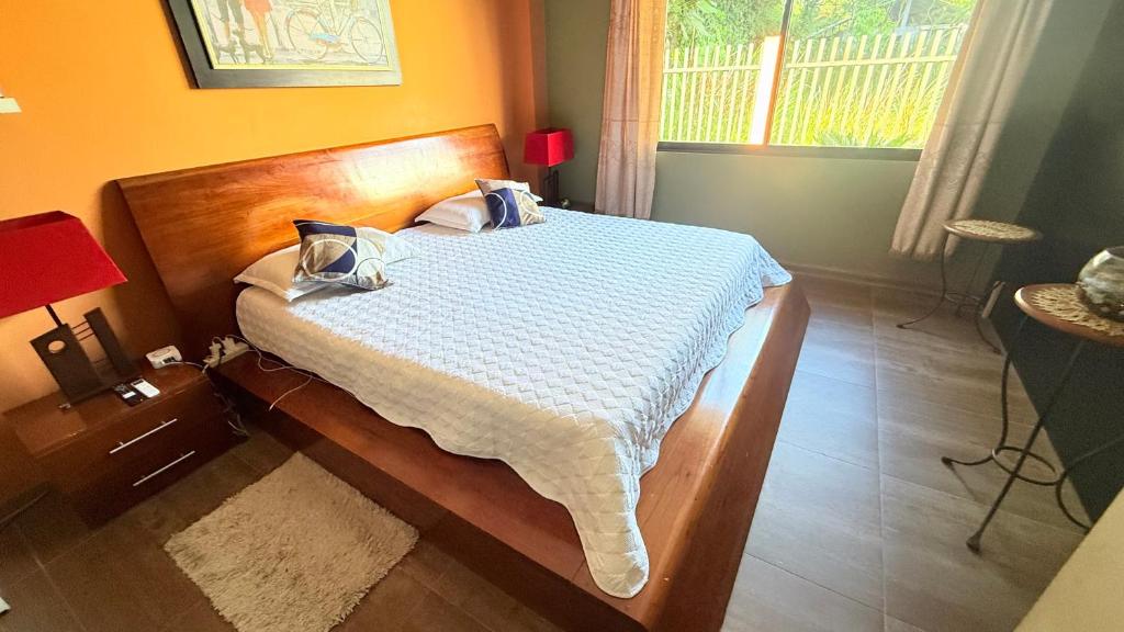 Postel nebo postele na pokoji v ubytování 1 Habitación Villa Mariaclaudia