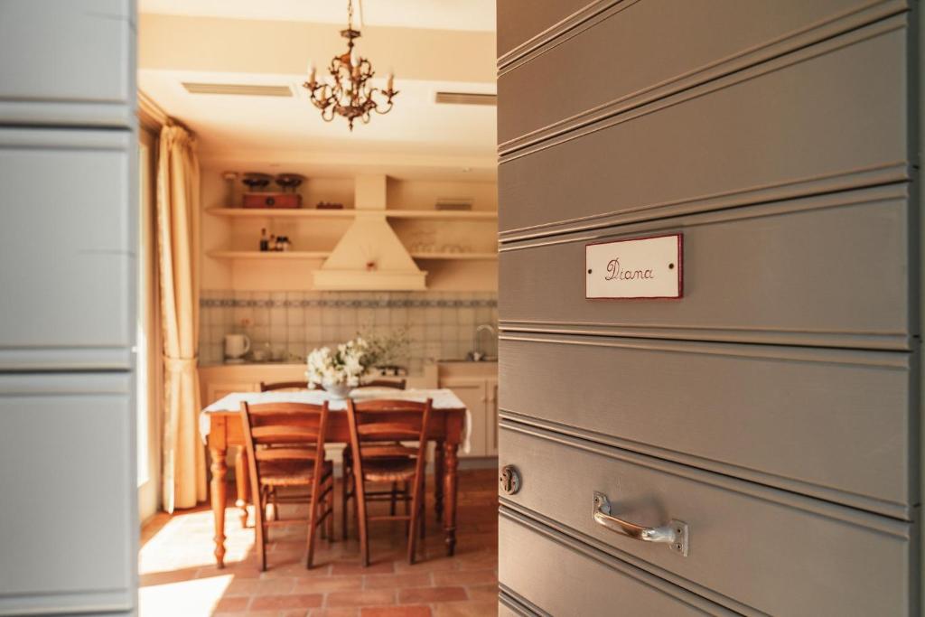 a kitchen and dining room with a table and chairs at Diana in Pesaro