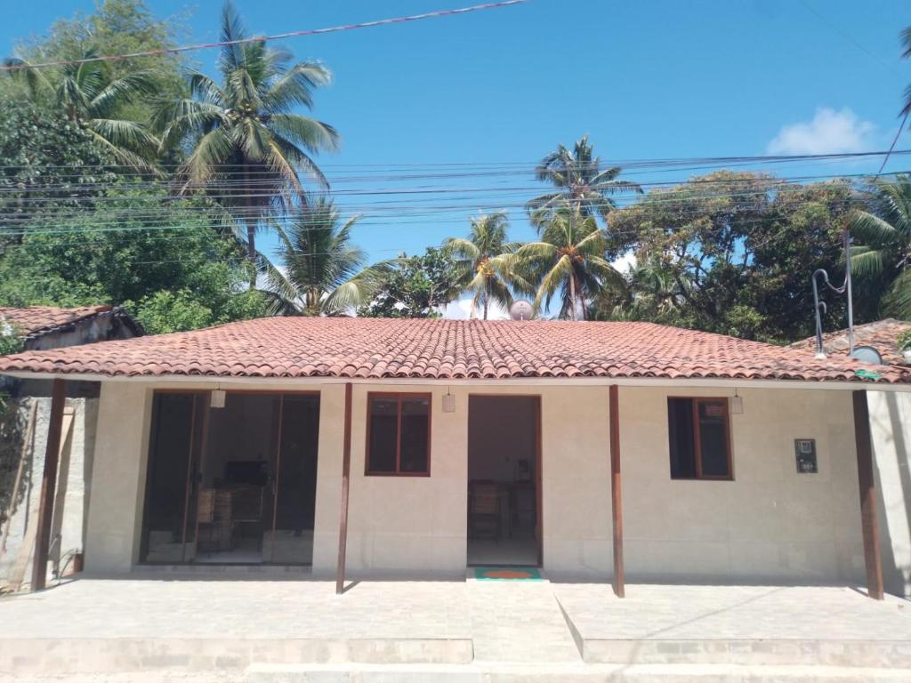 a small house with a red roof at Almar Maragogi in Maragogi