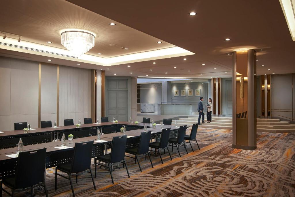 A conference room arranged in a U-shaped layout with presentation seating.