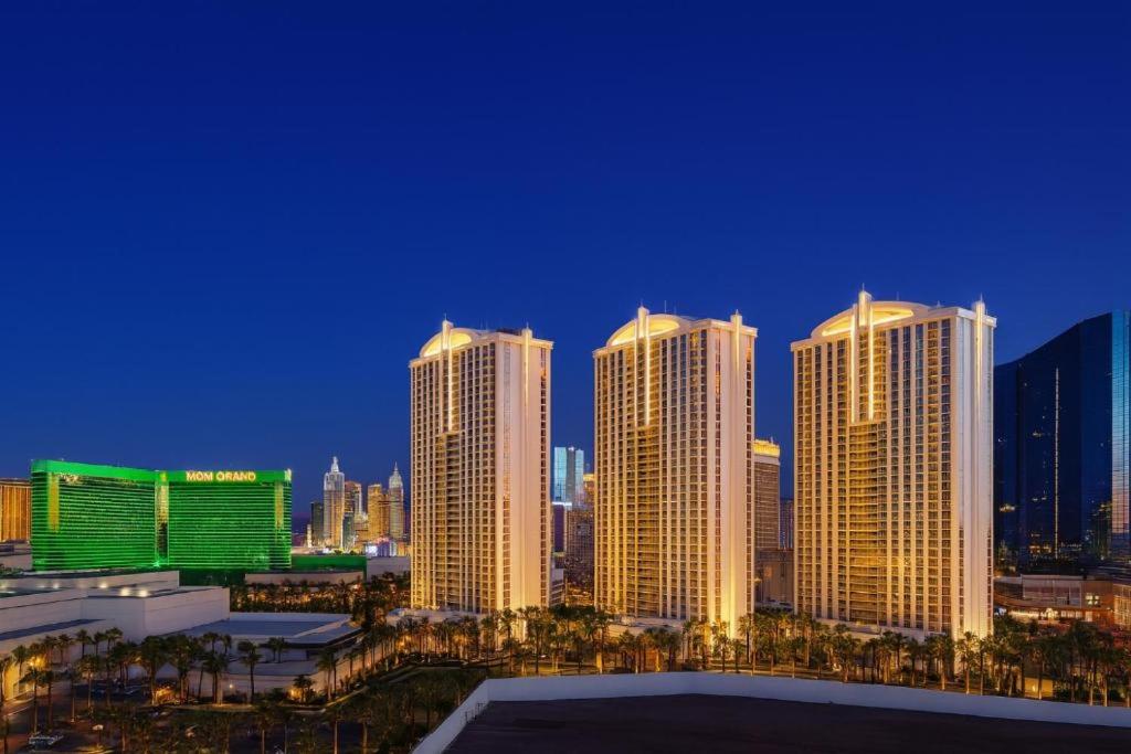 a group of tall buildings in a city at night at Private MGM Signature Studios in Las Vegas