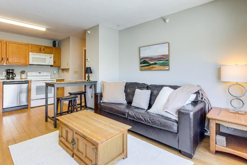 a living room with a couch and a table at Less Than 1 Mi to Big Sky Resort Quiet Mtn-View Retreat in Big Sky Mountain Village