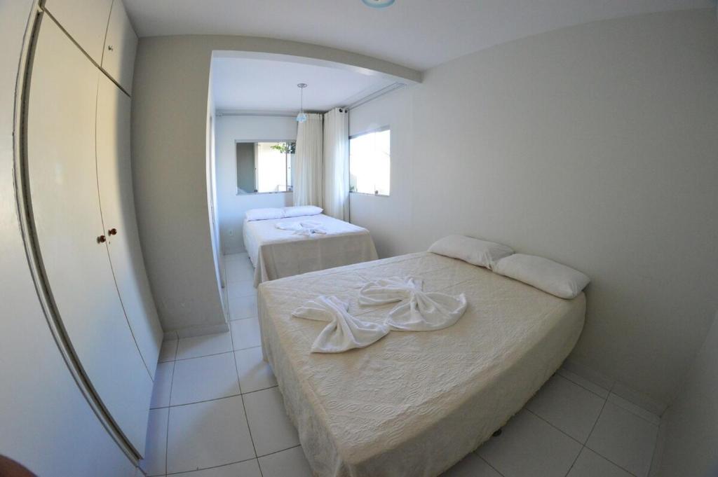 En eller flere senge i et værelse på Casa Chayenne