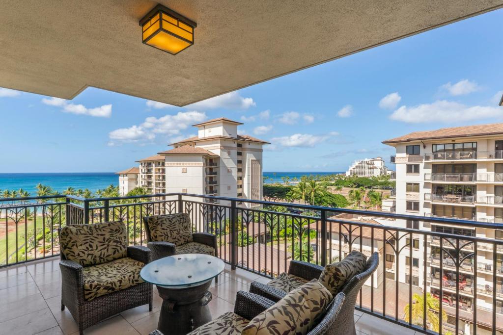 a balcony with chairs and a view of the ocean at Beach Villas at Ko Olina 8th floor Ocean View in Kapolei