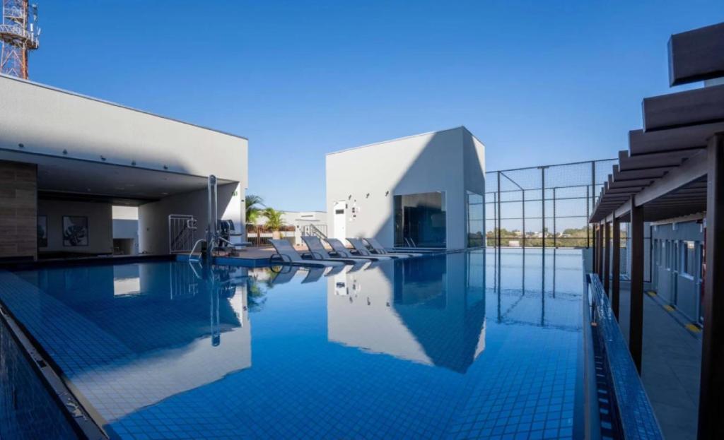 Bazén v ubytování Apto completo com estrutura de resort em Foz do Iguaçu nebo v jeho okolí