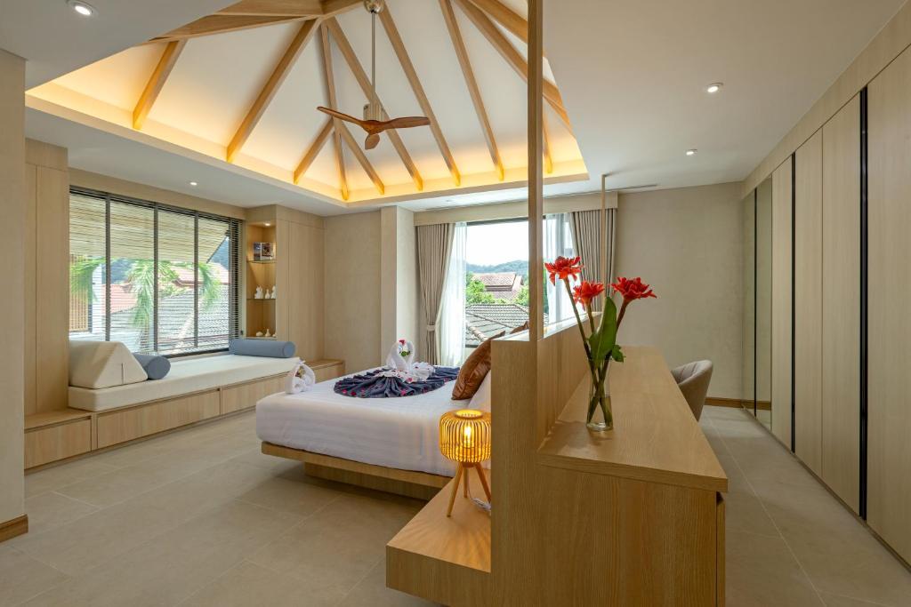 a bedroom with a bed and a living room at Kiang Tawan Villa 2 
