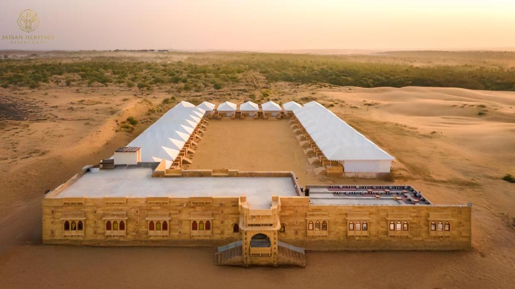 an aerial view of a building in the desert at Jaisan Heritage Desert Camp in Jaisalmer